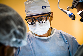 A doctor performing surgery