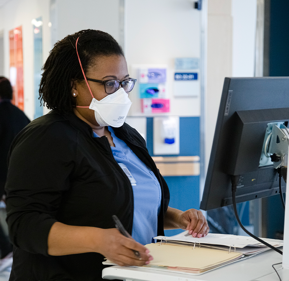 Schulich staff on the computer