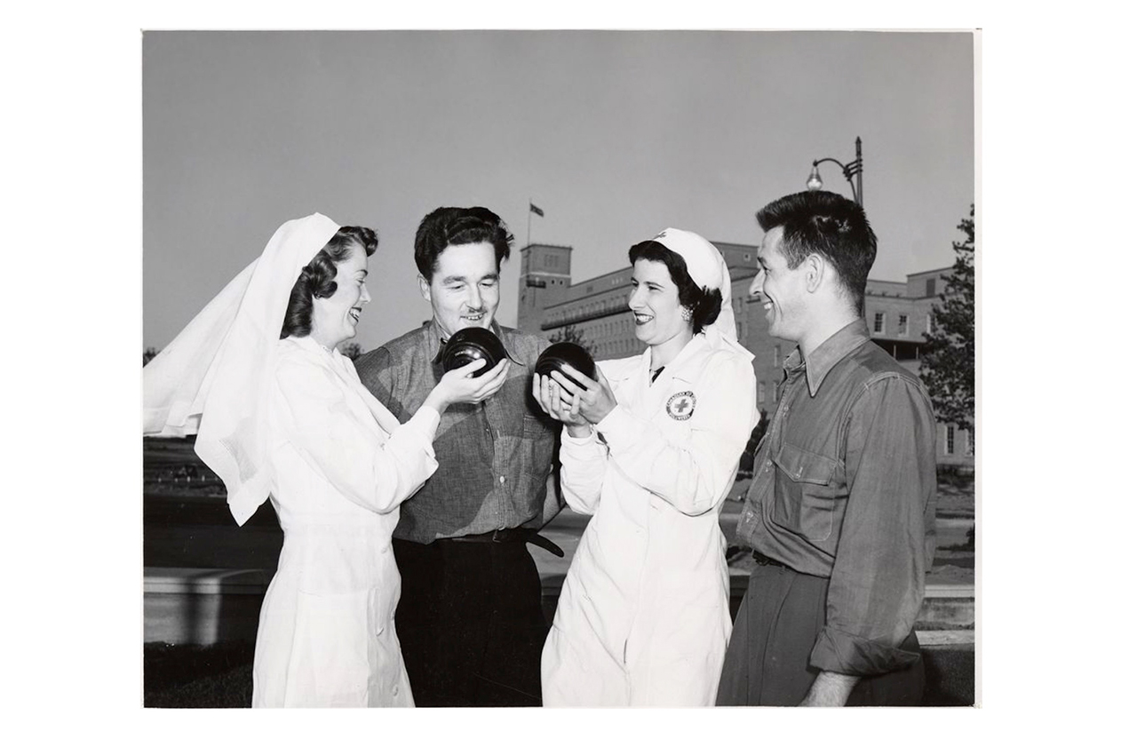 Red Cross Volunteers lawn bowling with veterans. 1950.