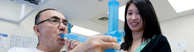 Man working with his respiratory therapist