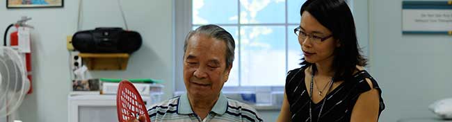 Man working with his rehab specialist